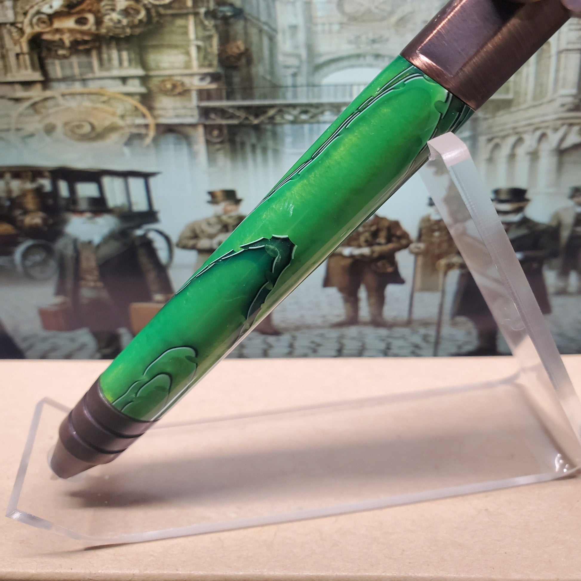 Closeup of green acrylic  portion of Steampunk writing pen