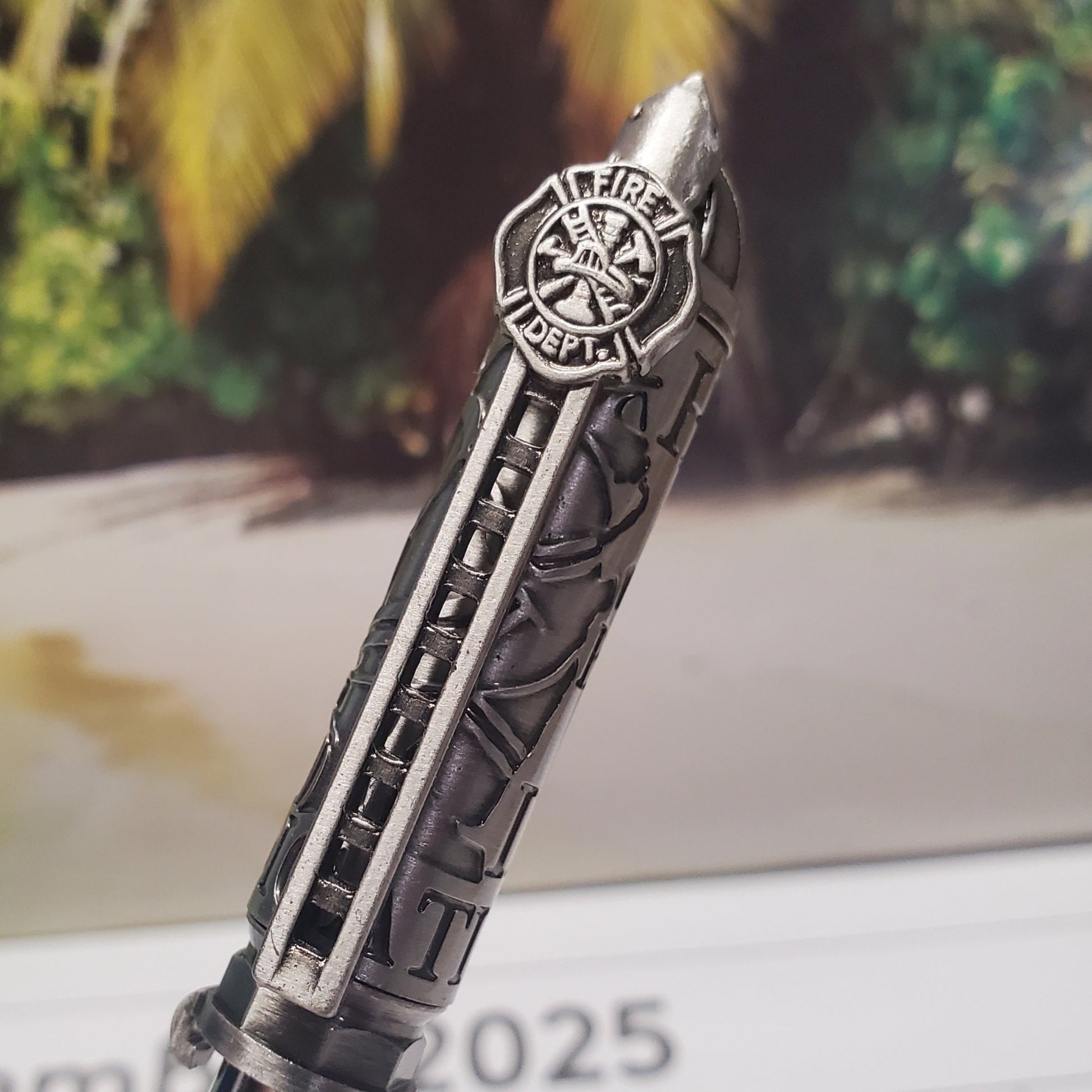Firefighter Pen Featuring a firetruck ladder and a firefighter helmet
