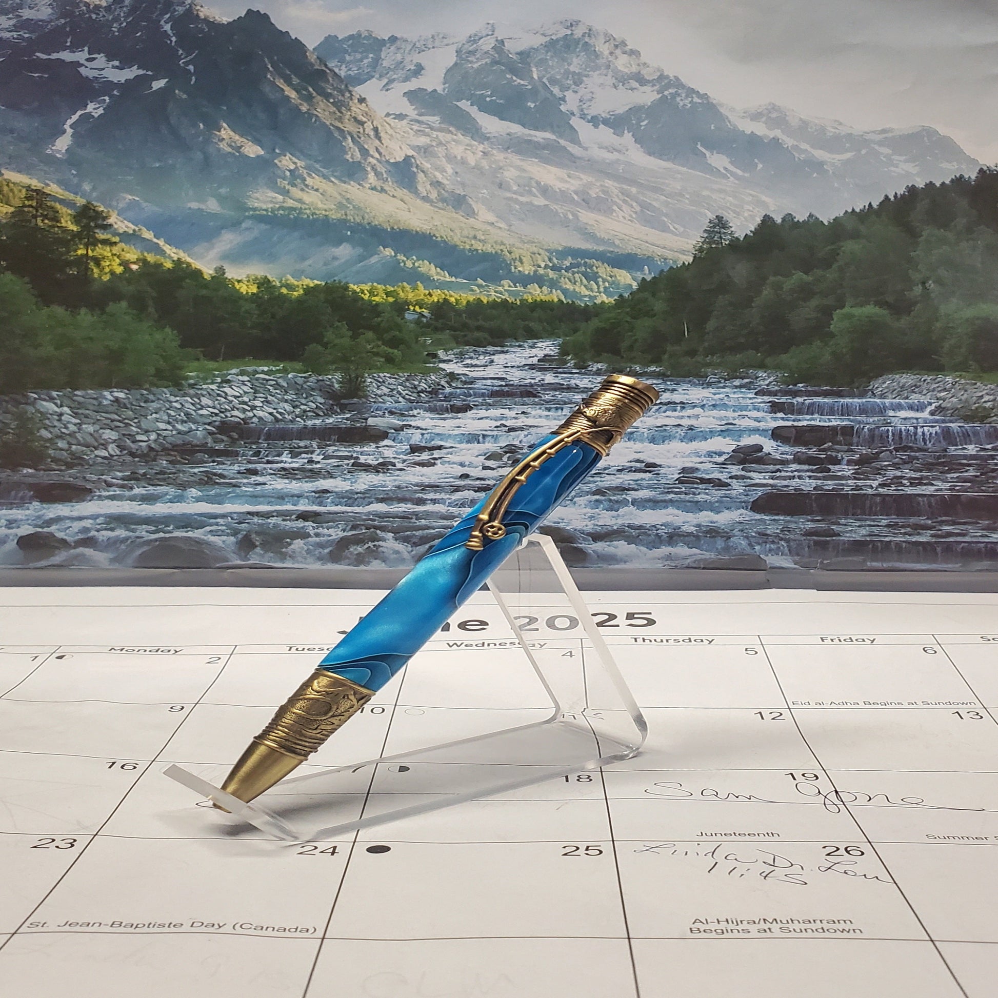 Decorative Flyfishing Writing Pen featuring antique brass settings with blue acrylic material