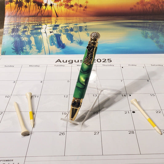 Golf writing pen featuring a green acrylic material and gold settings