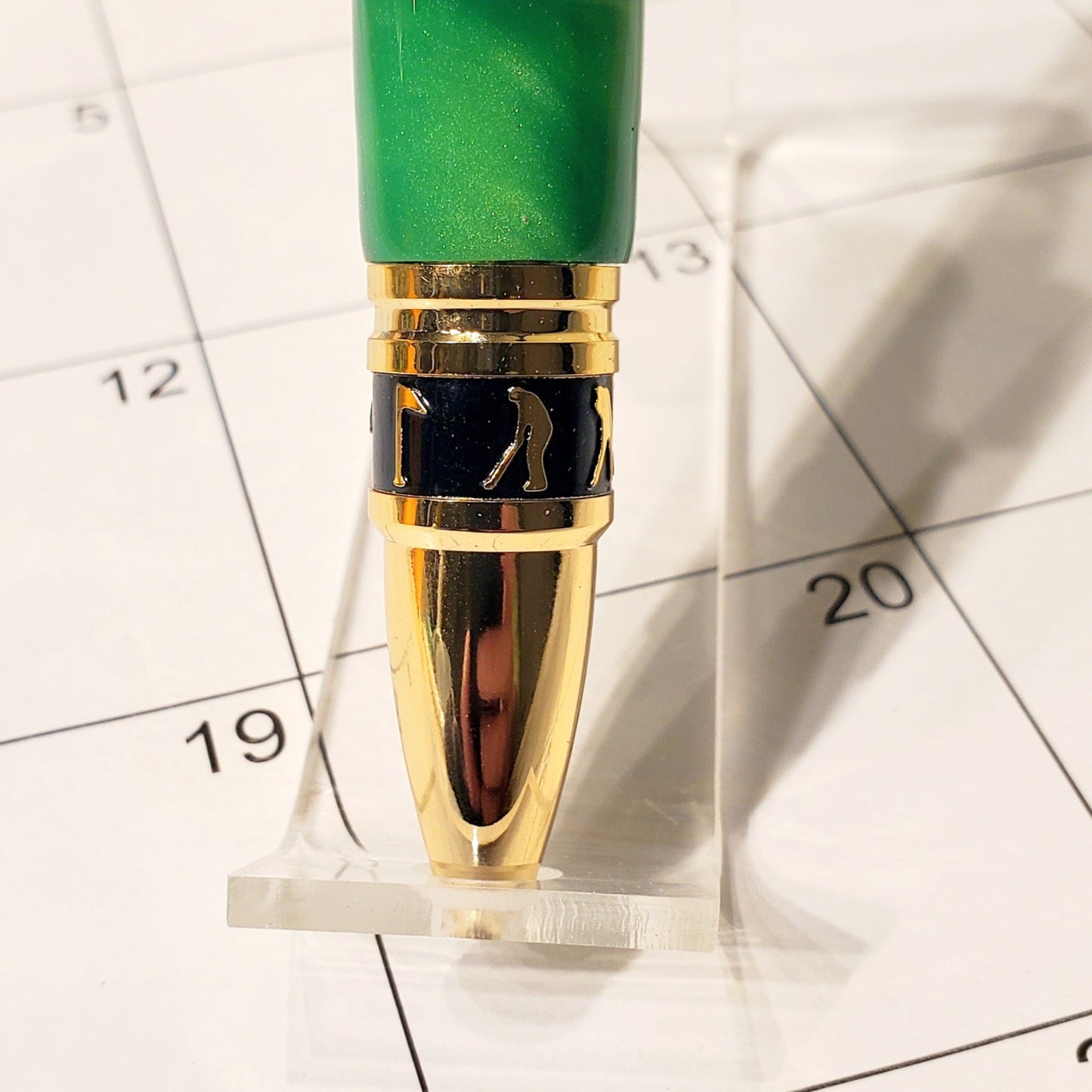 Tip of the Golf writing pen with silhouettes designed to look like Golfers