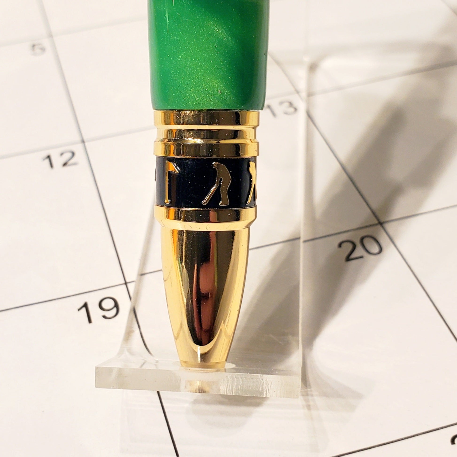 Tip of the Golf writing pen with silhouettes designed to look like Golfers