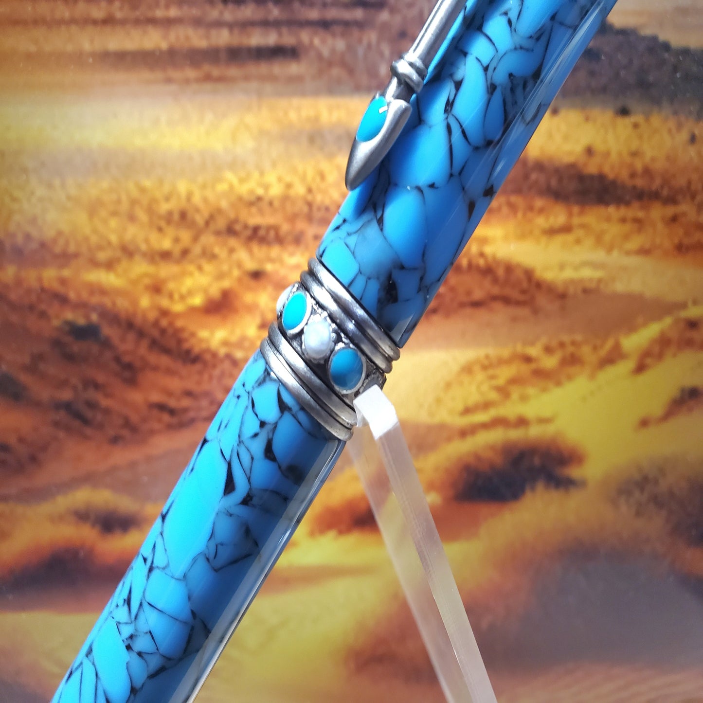 center of Southwestern Pen featuring silver center band with turquoise accents